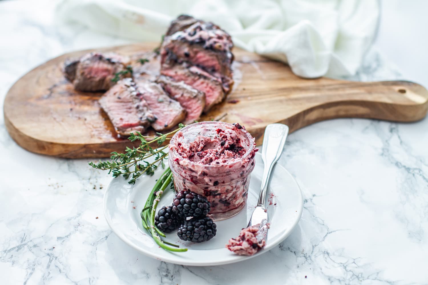 New York Strip Steak with Blackberry Herb Compound Butter