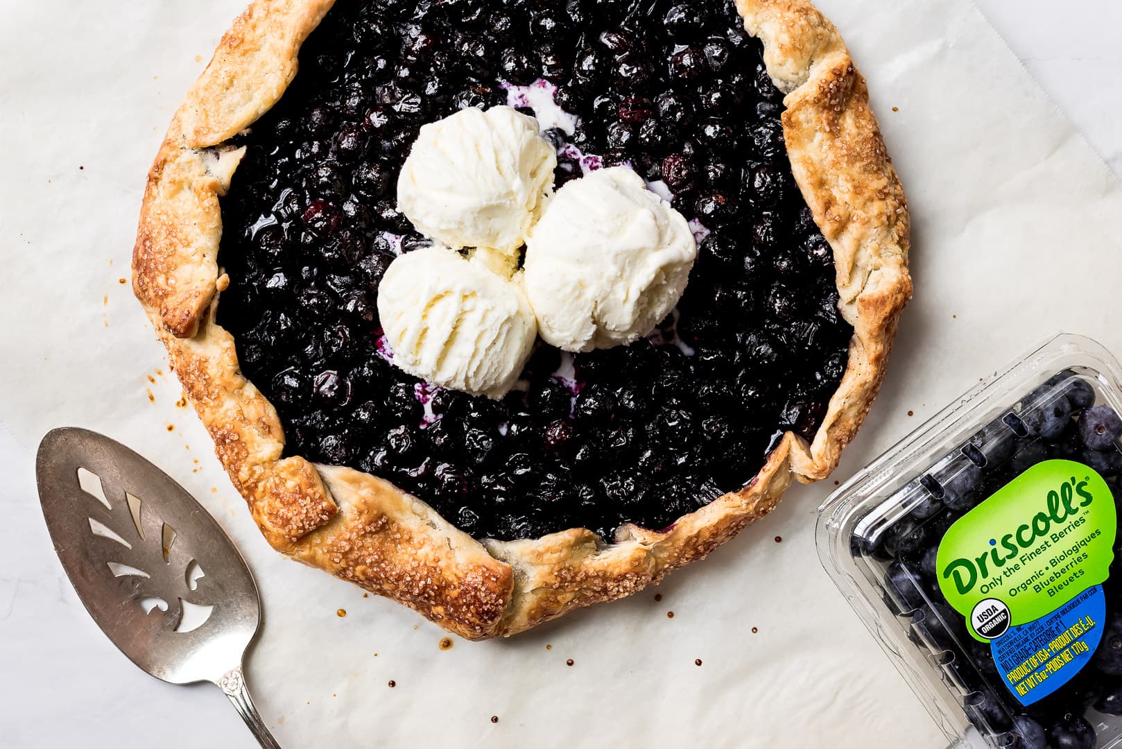 Driscoll's Blueberry Galette with ice cream and package of berries