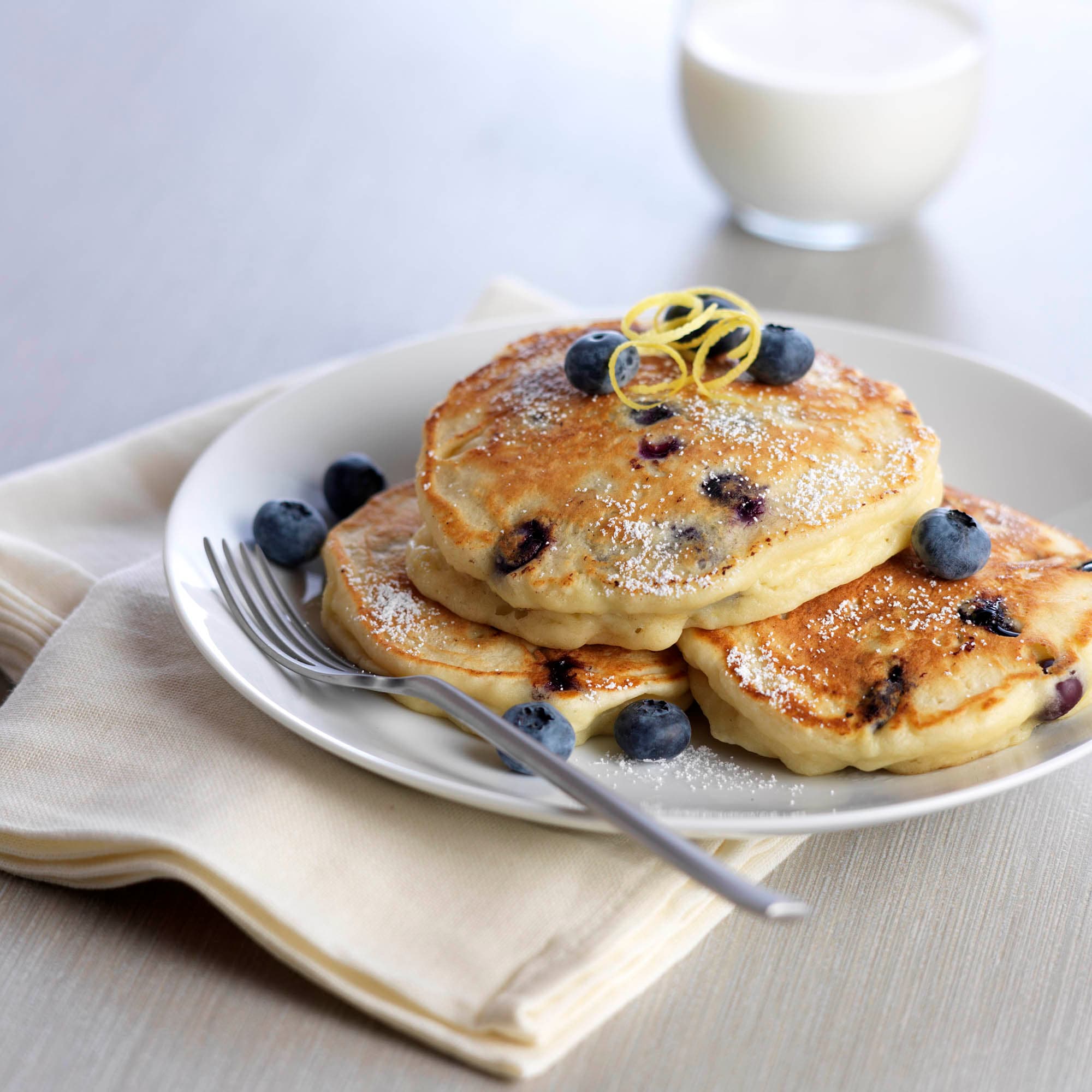 Plate of lemon blueberry ricotta pancakes