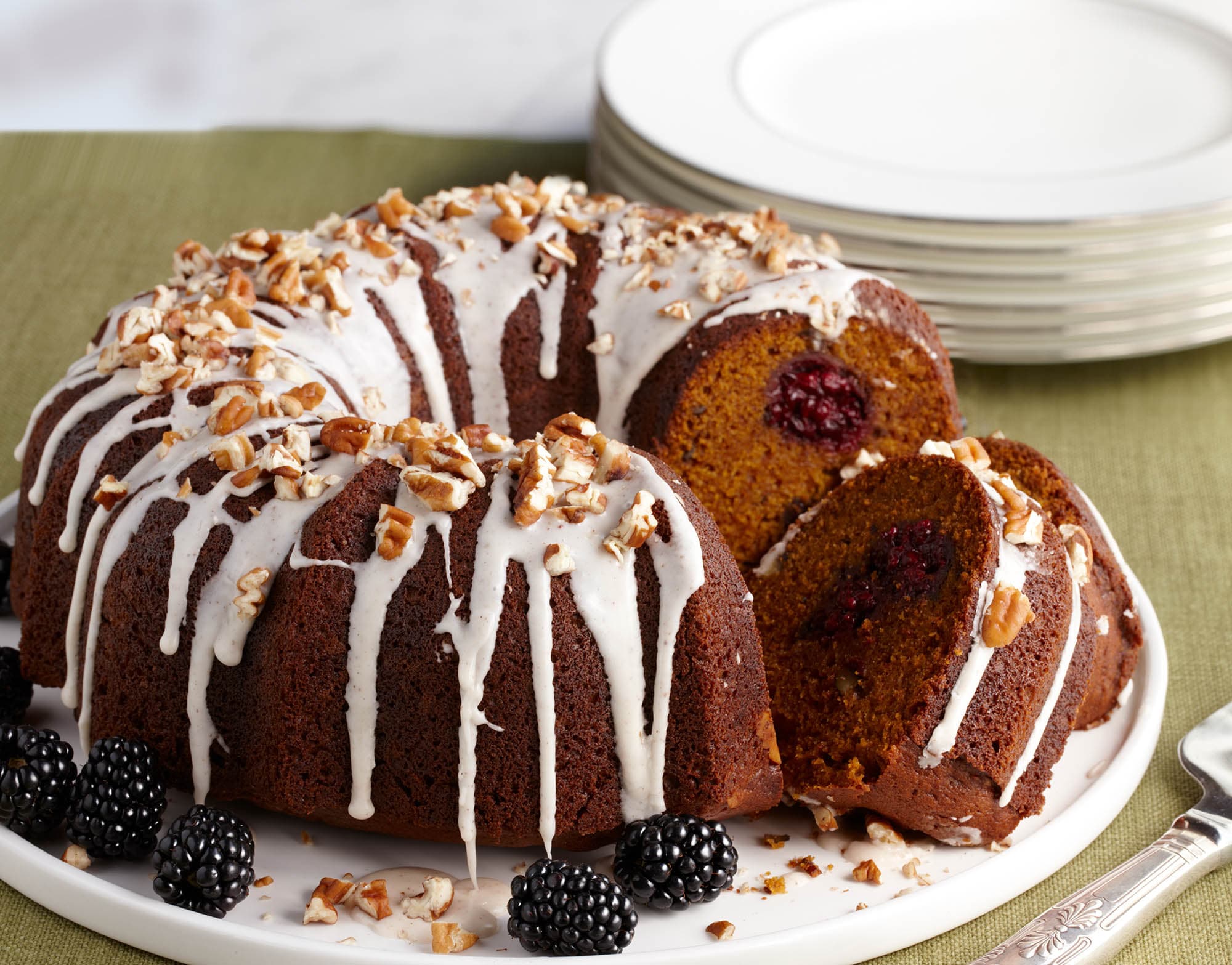 Pumpkin blackberry cake topped with icing