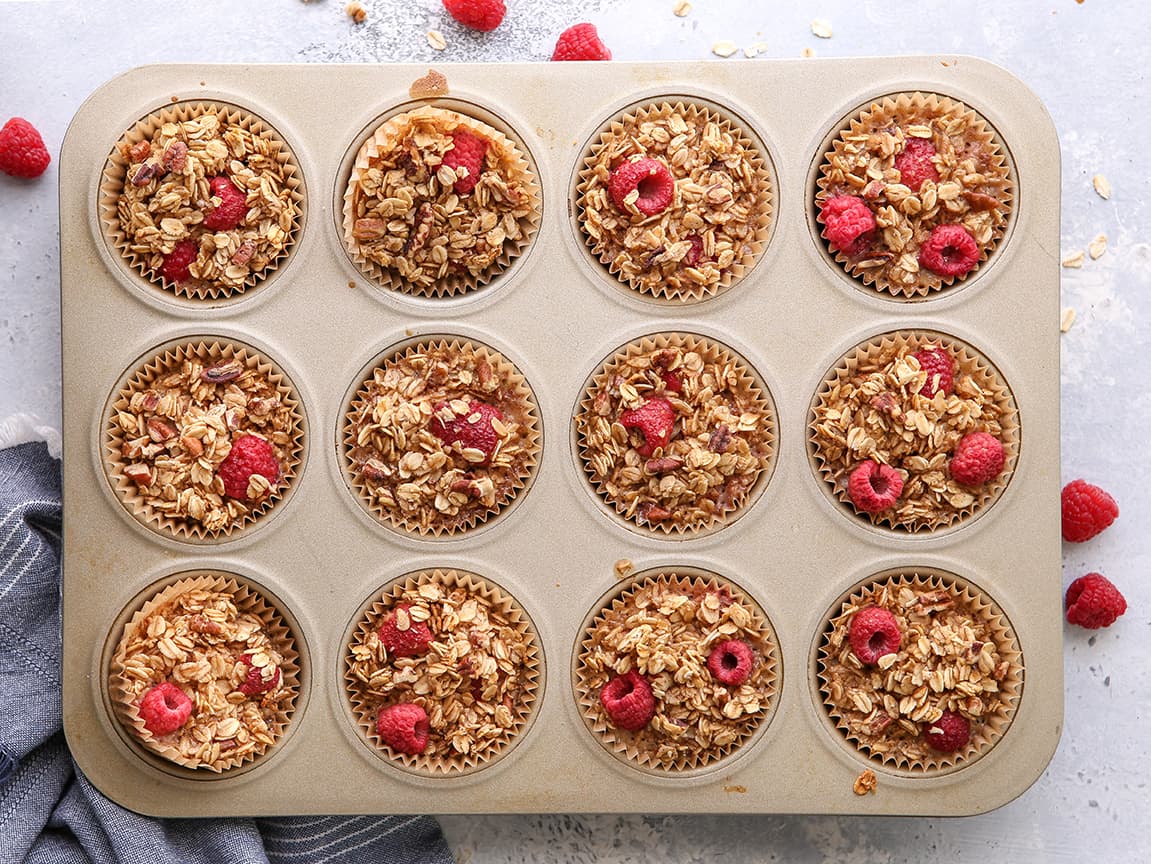 Raspberry Baked Oatmeal Cups in a muffin tin