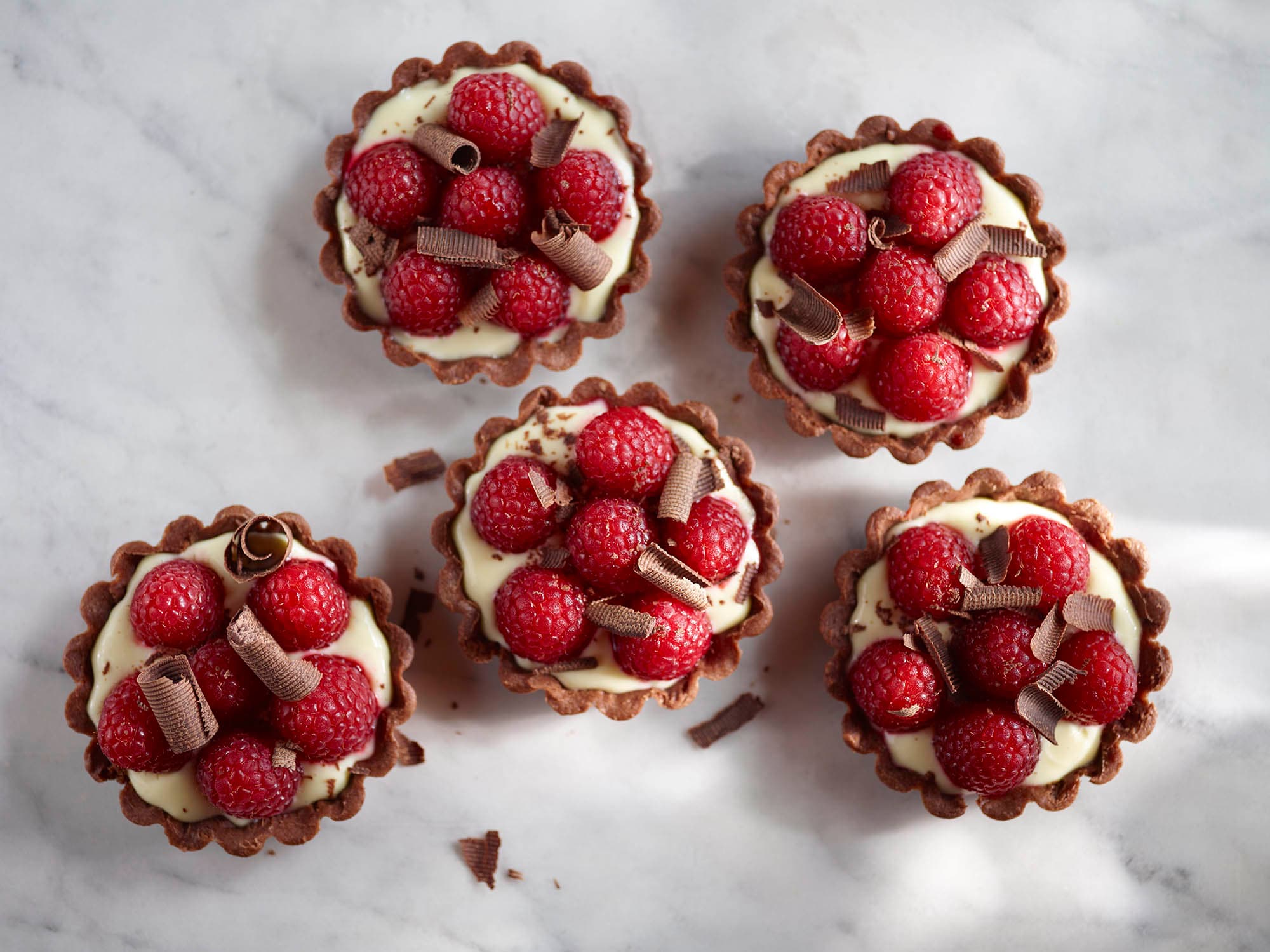 Five raspberry chocolate tarts
